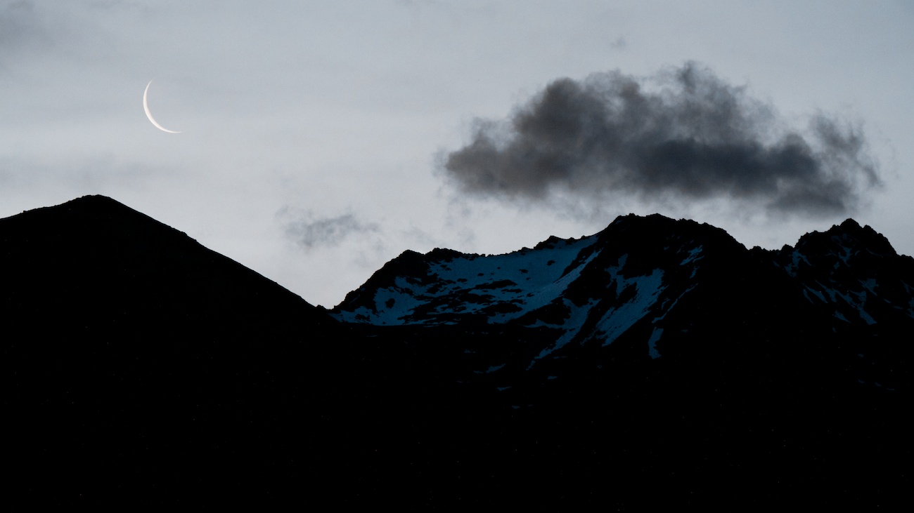 Waning crescent moon over mountains in Aoraki/Mount Cook NP